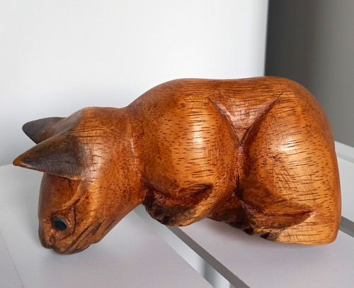 Hand carved wooden cat - hand,