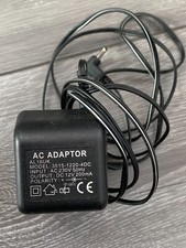 AC Adaptor AL16UK Model: 3515-1220-4DC. Input: AC230V 50Hz Output DC 12V 200mA