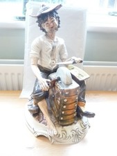 CAPODIMONTE STYLE CERAMIC FIGURINE - RUSTIC KNIFE GRINDER