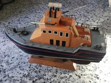 Vintage Lifeboat model on a wooden stand. Retro item for display
