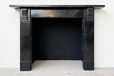 Victorian corbelled Kilkenny black marble fireplace surround. Circa 1850.