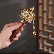 Tibetan prayer wheel turn - wheel,