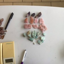 A Collection of Natural Rough Amazonite Amethyst and Rose Quartz Gemstones