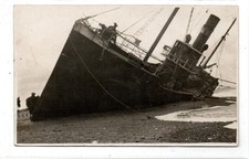 Picture postcard of a trawler (?) stranded at possibly Fleetwood (C93934)