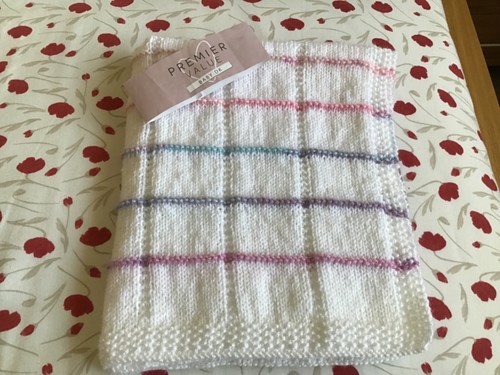 Hand knitted white baby - hand,