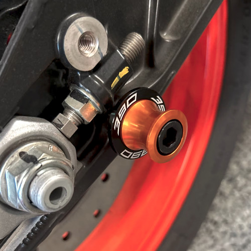 Rear swingarm spools - spools, paddock
