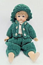 SMALL ANTIQUE REPRODUCTION BISQUE PORCELAIN DOLL. JOINTED DRESSED 12" BOY