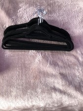 coat hangers black velvet covered. There are 20 in total.