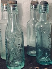 Four antique bottles all with - antique,