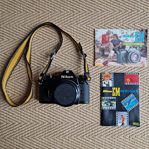 Nikon black 35mm slr film - em,