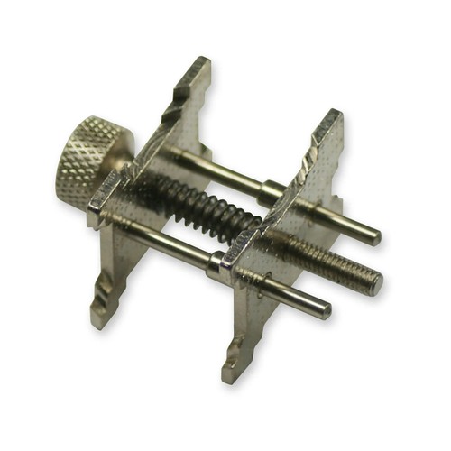 Movement holder clamp - in,