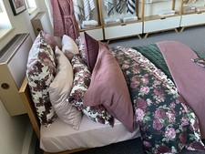 A high-quality Exhibition double bed with matching mattress and frame,