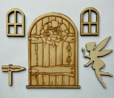 Wooden fairy door and windows