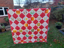 Patchwork lap quilt, floating squares, cream, orange yellows, hand quilted
