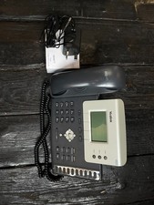 Grey Office desk phone, corded.