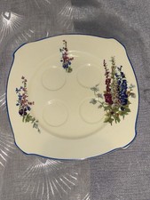 Newhall Pottery England, Hollyhock pattern, egg plate, square, blue trim.