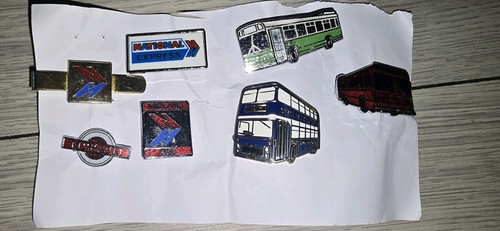 Bus badges and a tie - x,