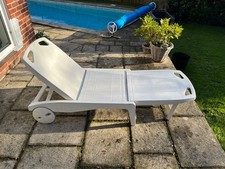White plastic sun lounger used