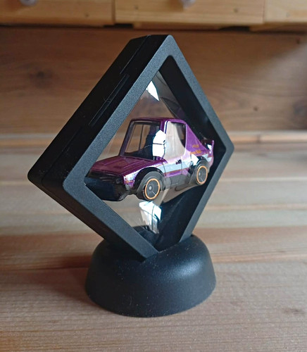 Purple diecast model car with - purple,