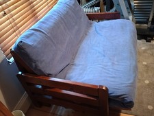 futon company two seater double sofa bed. Blue washable cover solid wood base