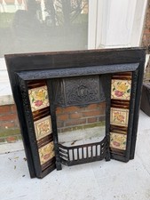 TILED CAST IRON FIREPLACE /