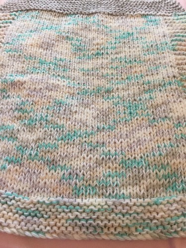 Hand knitted baby blanket pram