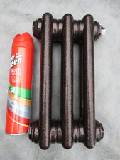 A UNUSED SMALL ZEHNDER RADIATOR IN BROWN METALLIC 29cm H