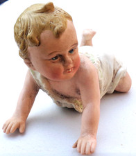 Antique Victorian Bisque Piano Doll in good pose and showing his two front Teeth