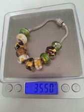 Sterling Silver Rhona Sutton Charm Bracelet With 10 Charms.