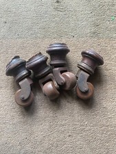 Large Victorian brown ceramic wheel castors and brass collars X4