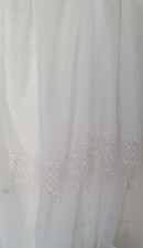 White Voile Panel With Macrame Style Tassel At The Bottom