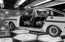 Models pose within a cutaway