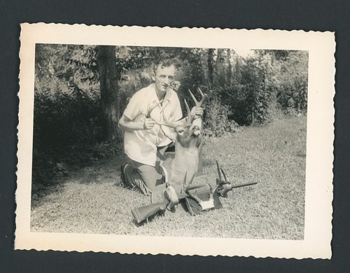 Man with mounted deer head - man,