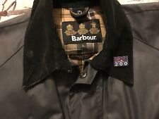 RSPCA Metal pin badge. Metal Enamel Brooch,Blue,displayed on Barbour jacket