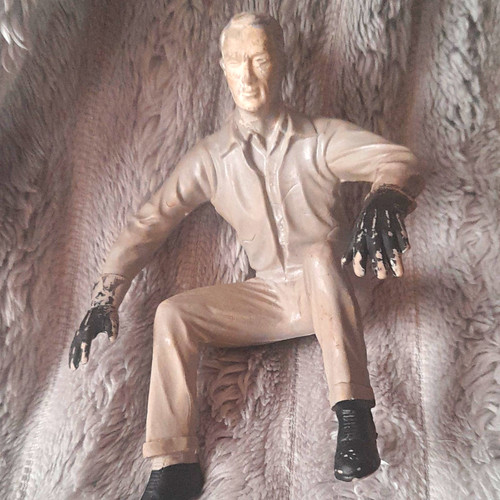 Seated man plastic figurine - plastic,