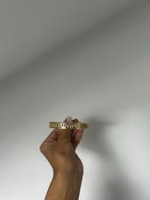 Brand new, yellow miu miu bracelet, comes with authentication booklet