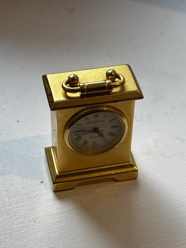 Small gold tone antique clock - tone,