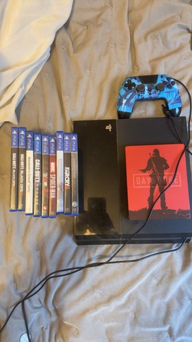 Playstation with games and - 4,
