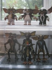 Gremlins Collection x7 Figures In Display Case with door. (Not Fixed In).