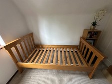 Solid oak bed frame with matching trundle bed and mattress for each