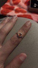 oval-cut-fire opal set in gold