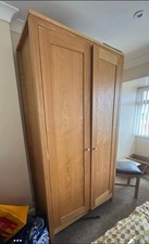 TALL OAK WADROBE COST £850  H215 X W100 X D590 DISASSEMBLED READY SEE PICTURES
