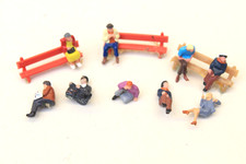 SEATED CIVILIAN FIGURES