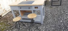 rustic farmhouse style kitchen island with butchers block top and 2 stools