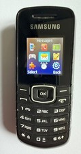Samsung GT-E1080i Vintage Mobile Phone with charger and manual