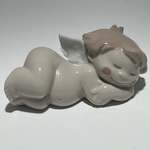 Nao lladro cheeky cherub - by,