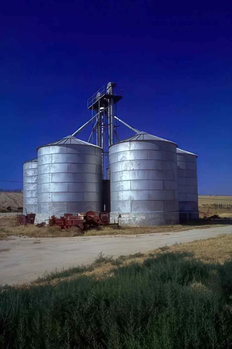 Grain silos tractor photo - grain,