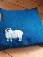 HARRIS TWEED CUSHION. BLUE WITH SHEEP MOTIFF. EXCELLENT CONDITION.