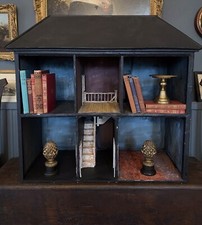 Antique dolls house repurposed as an unusual display piece