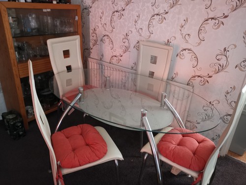 Glass oval dining table and